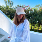 Wiild Swimwear Mahua Cap in beige color  viewed from the front on model