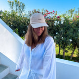 Wiild Swimwear Mahua Cap in beige color  viewed from the front on model