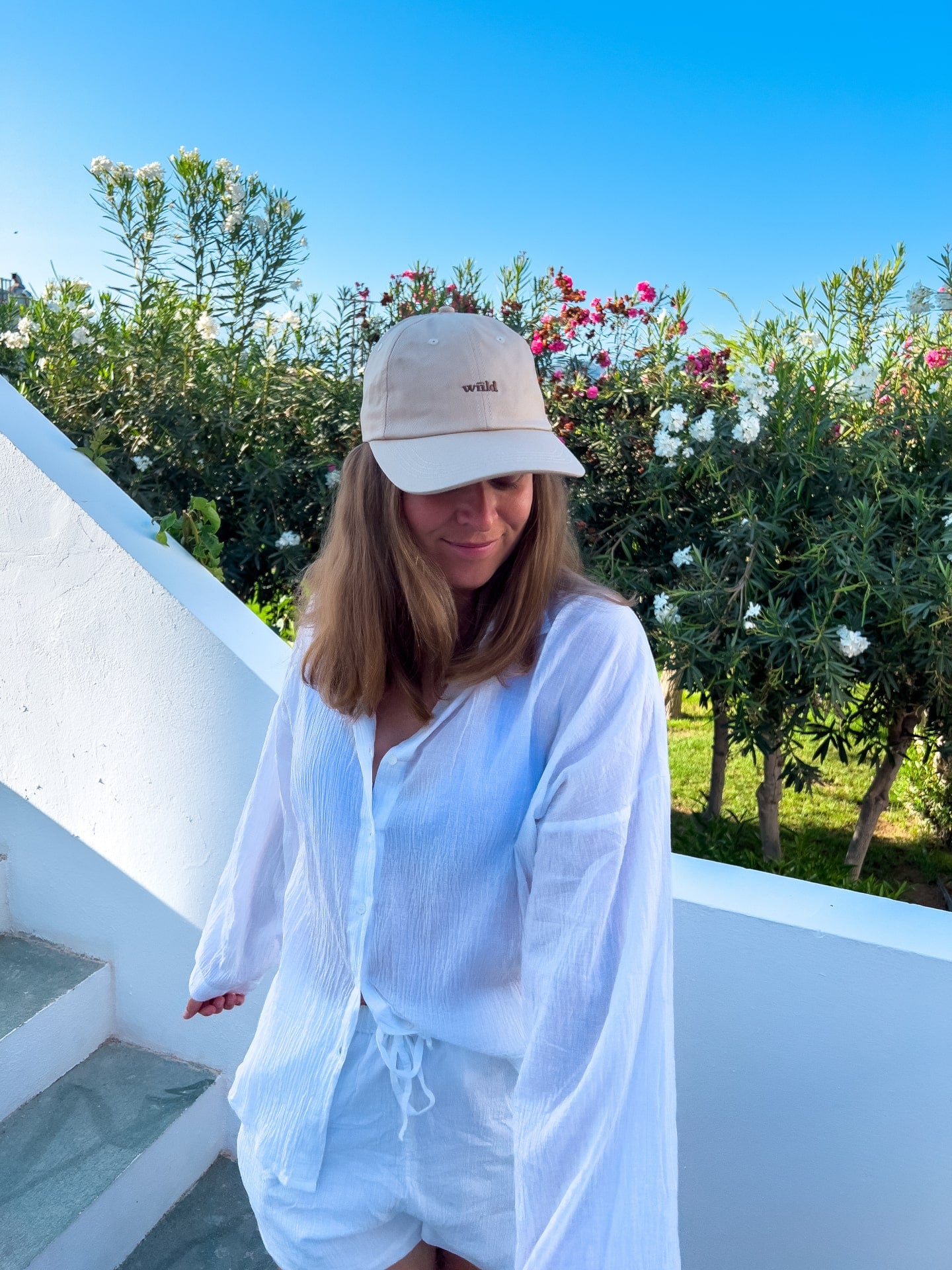 Wiild Swimwear Mahua Cap in beige color  viewed from the front on model
